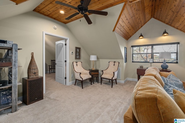 sitting room with vaulted ceiling, baseboards, wood ceiling, and light colored carpet