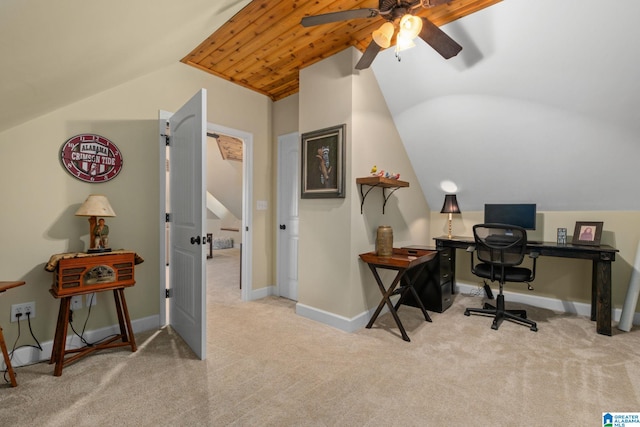 carpeted home office with lofted ceiling, baseboards, and a ceiling fan