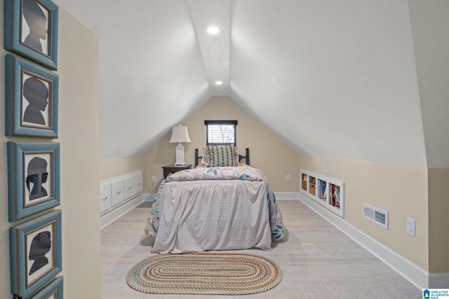 bedroom with lofted ceiling, recessed lighting, wood finished floors, visible vents, and baseboards