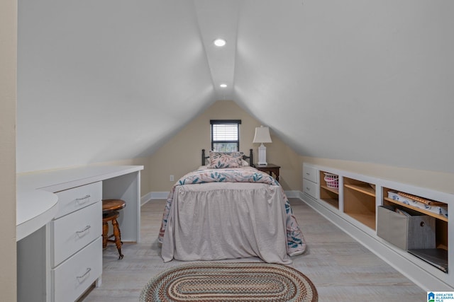 bedroom with recessed lighting, vaulted ceiling, light wood finished floors, and baseboards