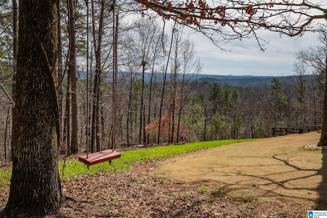 mountain view with a wooded view