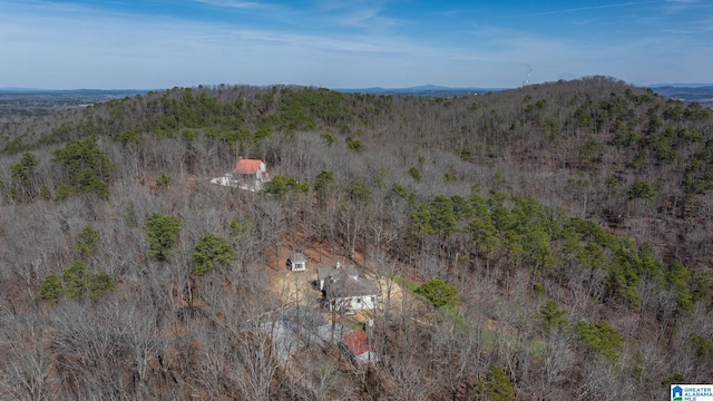 aerial view with a mountain view and a view of trees