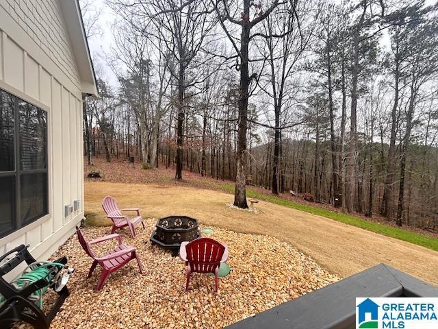 view of yard featuring a fire pit