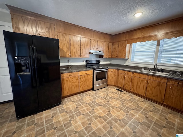 kitchen featuring a sink, black fridge with ice dispenser, stainless steel electric range, brown cabinets, and dark countertops