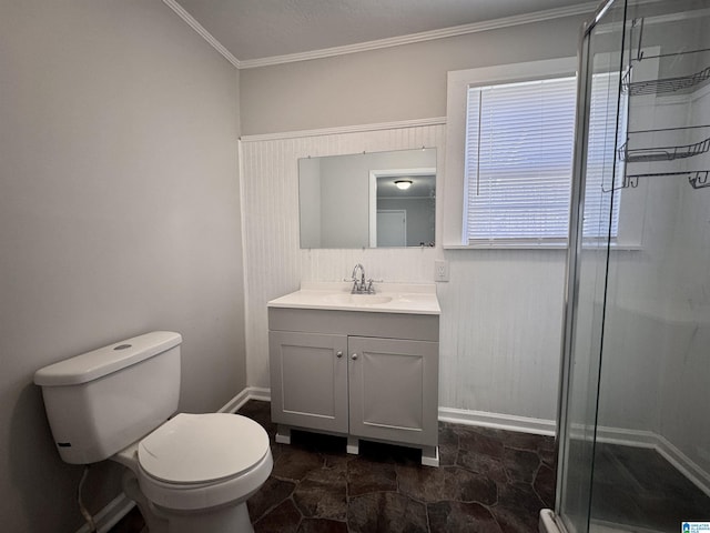 bathroom featuring toilet, vanity, baseboards, ornamental molding, and a shower stall