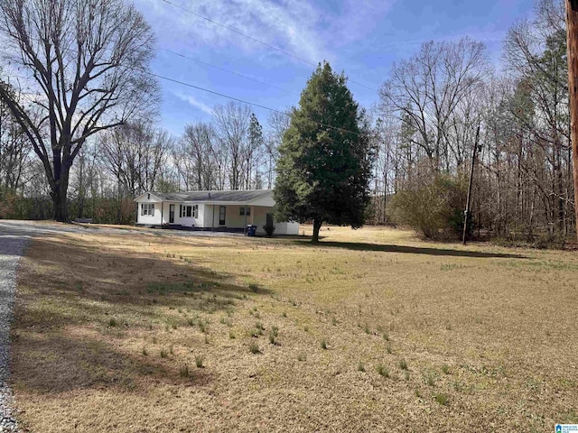 ranch-style home with a front yard