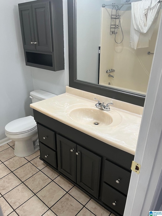 full bathroom featuring toilet, tile patterned flooring, vanity, and tub / shower combination