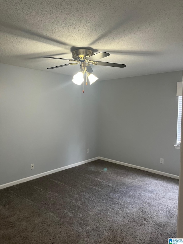 carpeted empty room featuring a textured ceiling and ceiling fan