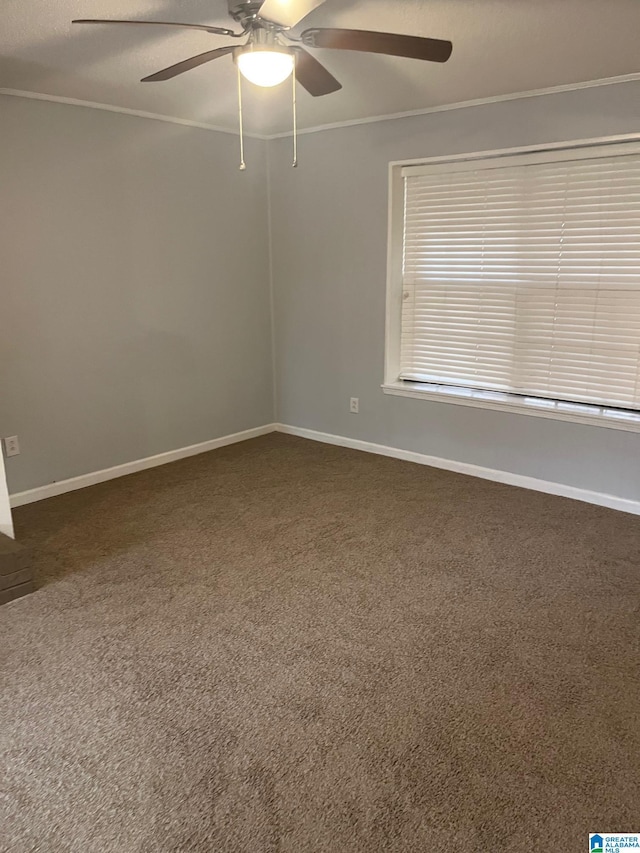 carpeted spare room with ceiling fan, ornamental molding, and a textured ceiling