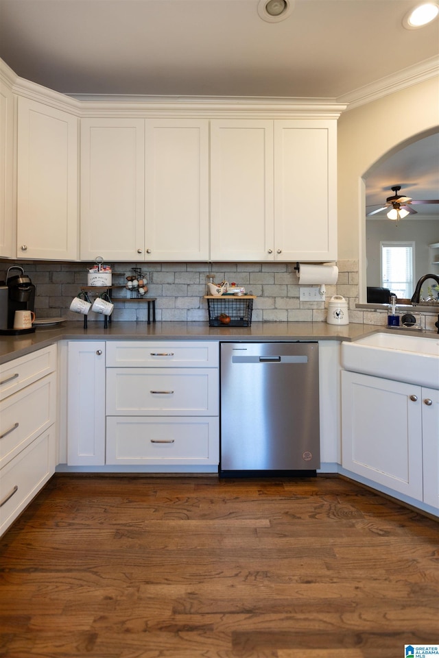 kitchen with white cabinetry, crown molding, and stainless steel dishwasher