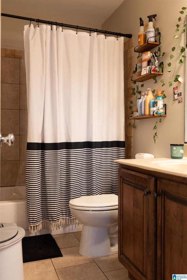 full bath with shower / tub combo with curtain, vanity, toilet, and tile patterned floors