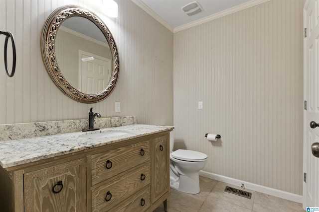 bathroom featuring vanity, crown molding, toilet, and tile patterned floors