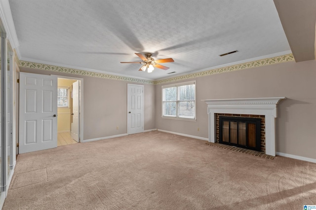 unfurnished living room with a fireplace, ornamental molding, a textured ceiling, and light colored carpet