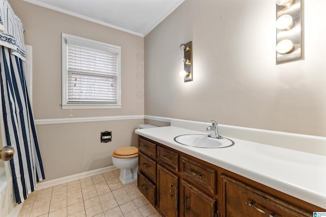 bathroom featuring tile patterned floors, ornamental molding, vanity, and toilet