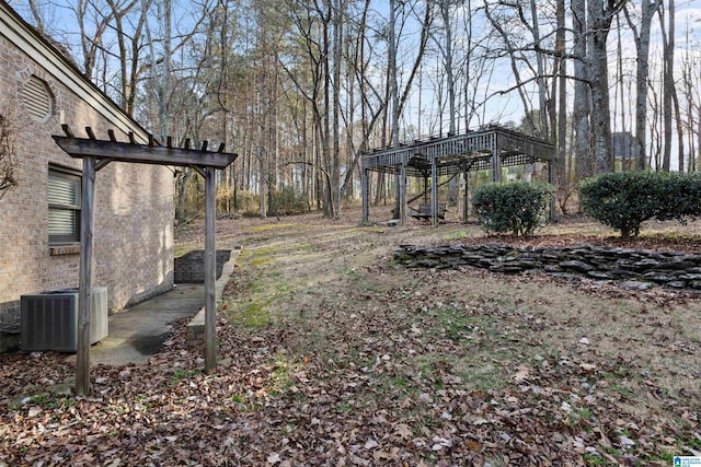 view of yard featuring central air condition unit