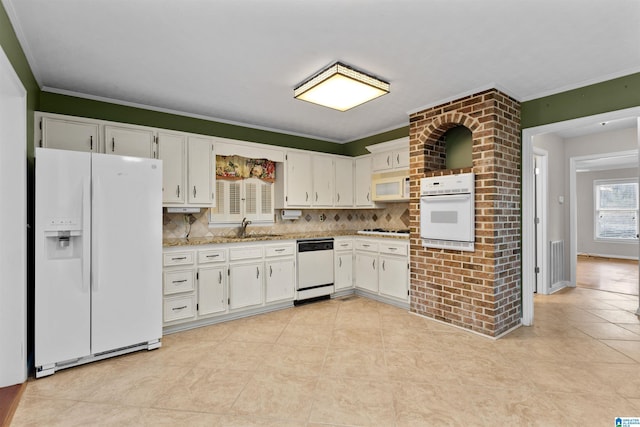 kitchen with white cabinetry, ornamental molding, white appliances, and sink