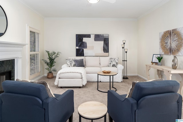 living area featuring baseboards, ornamental molding, a fireplace, and light colored carpet