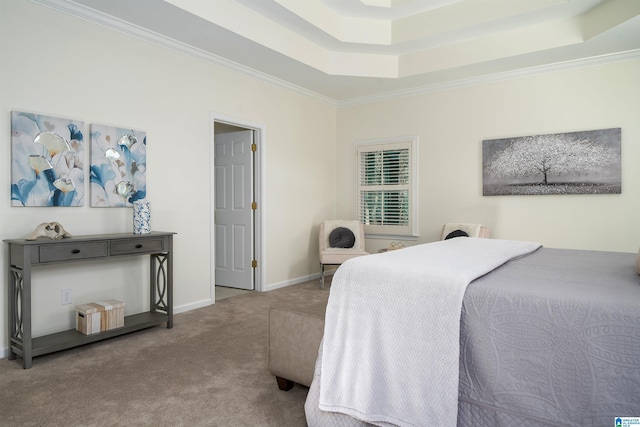 bedroom featuring ornamental molding, a tray ceiling, light carpet, and baseboards