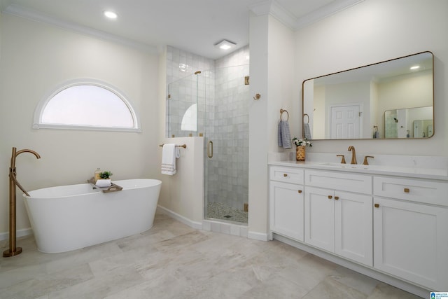 bathroom with a soaking tub, a shower stall, vanity, and crown molding