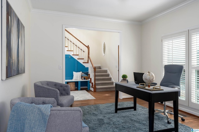 office space with crown molding and wood finished floors