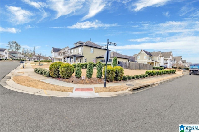 exterior space with a residential view and fence