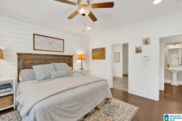 bedroom with dark wood-style floors, crown molding, recessed lighting, a ceiling fan, and baseboards