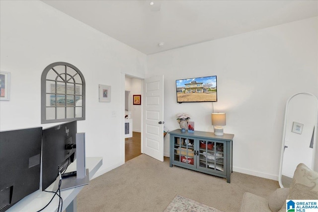 interior space with carpet floors and baseboards