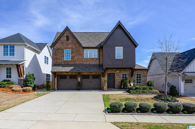 view of front of property with concrete driveway, brick siding, an attached garage, and a shingled roof