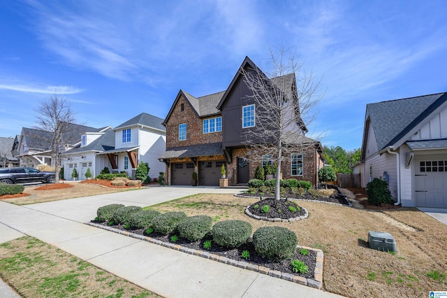 view of front of house featuring a garage, brick siding, and driveway