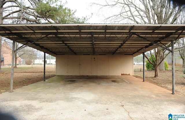 view of parking / parking lot featuring a carport