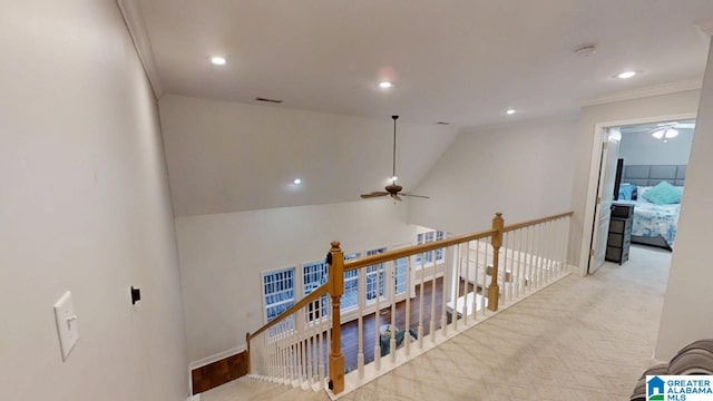 hall with recessed lighting, ornamental molding, visible vents, an upstairs landing, and vaulted ceiling