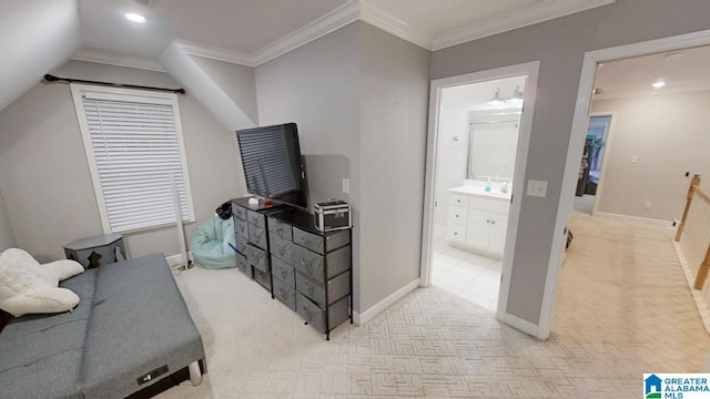 bedroom featuring baseboards, light carpet, and crown molding