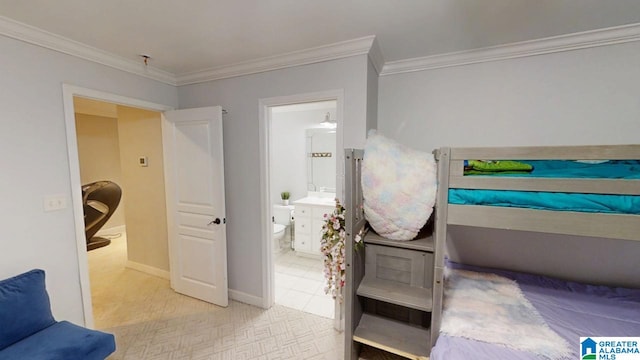 bedroom featuring crown molding, connected bathroom, baseboards, and light carpet