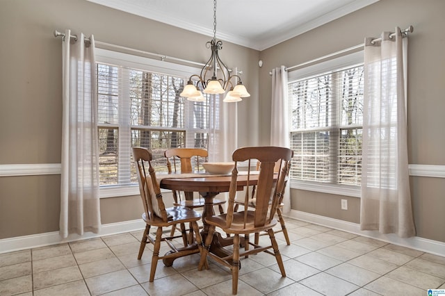 dining space with ornamental molding, light tile patterned floors, and plenty of natural light