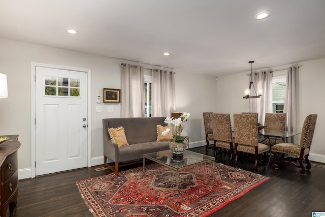 living room featuring dark wood-style floors, recessed lighting, and baseboards