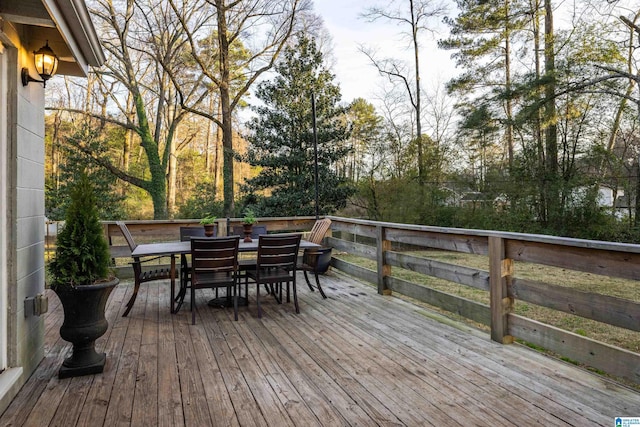 wooden deck featuring outdoor dining space