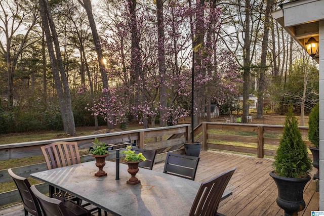 wooden terrace featuring outdoor dining space