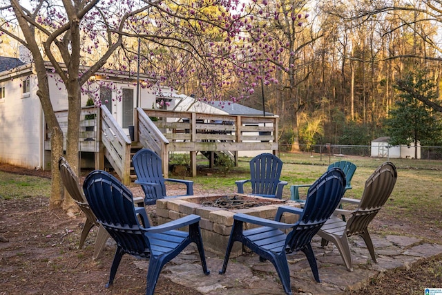 view of patio / terrace featuring a fire pit and fence