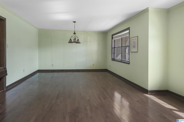 unfurnished dining area featuring ornamental molding, dark wood finished floors, and baseboards