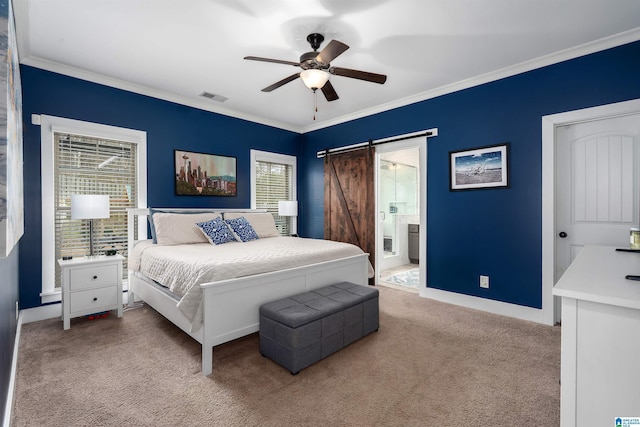 bedroom with a barn door, visible vents, baseboards, light colored carpet, and ornamental molding