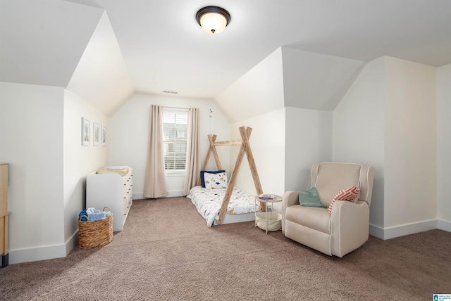 interior space featuring carpet, visible vents, lofted ceiling, and baseboards