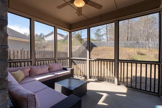 sunroom / solarium with a ceiling fan