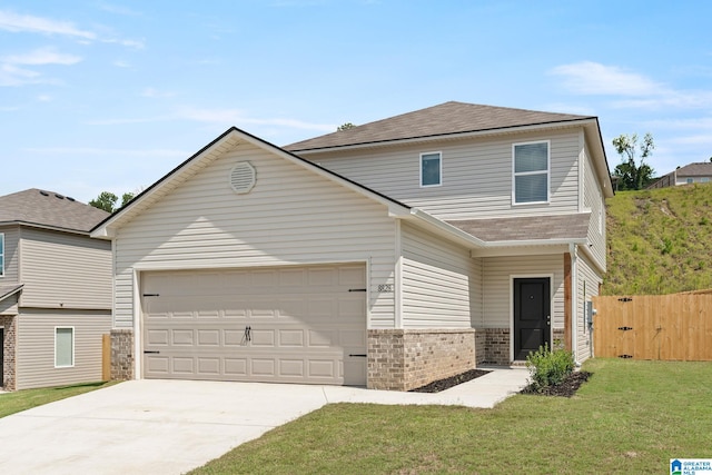 traditional-style home with brick siding, concrete driveway, an attached garage, fence, and a front lawn