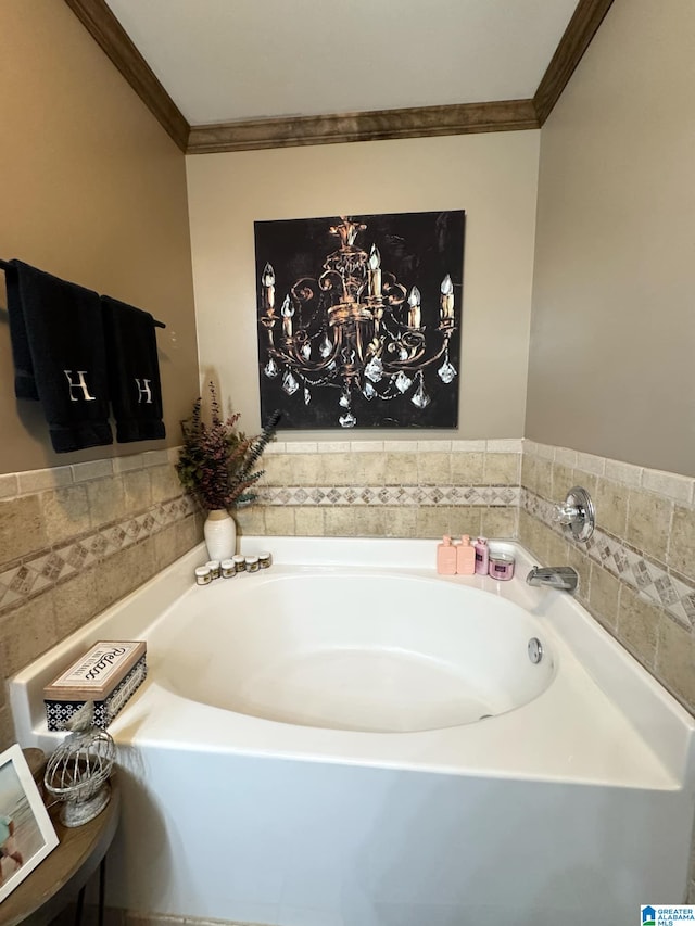 bathroom with a bath and crown molding