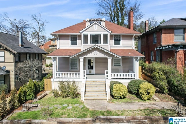 view of front facade with covered porch and stairway