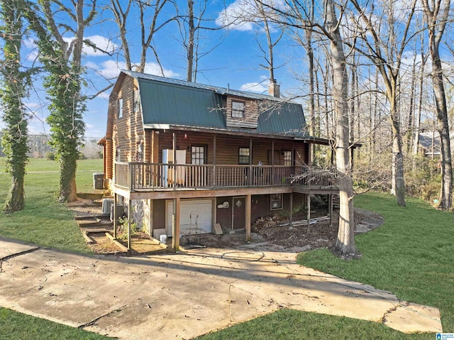 view of front facade featuring a chimney, a gambrel roof, metal roof, driveway, and a front lawn