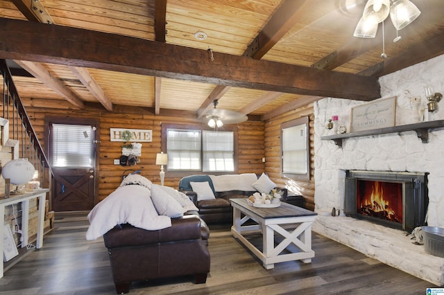 living room with dark wood-style floors, wood ceiling, rustic walls, and a ceiling fan