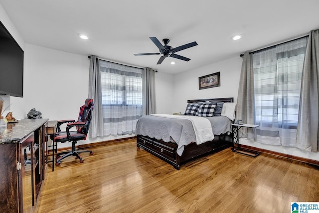 bedroom with a ceiling fan, recessed lighting, and light wood-style flooring