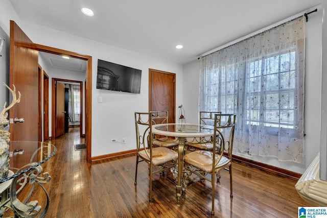 dining room featuring recessed lighting, wood finished floors, attic access, and baseboards