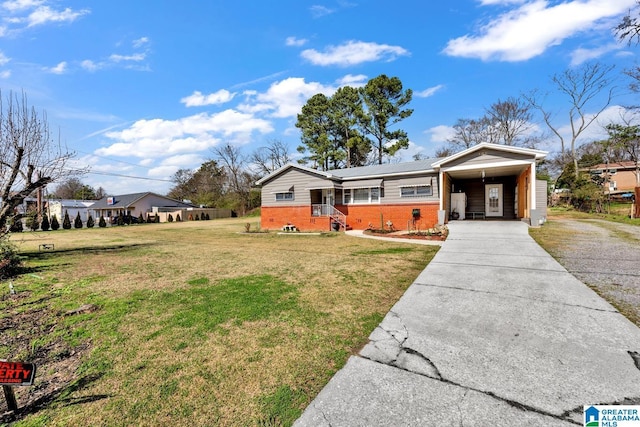 ranch-style house with a carport, driveway, brick siding, and a front yard